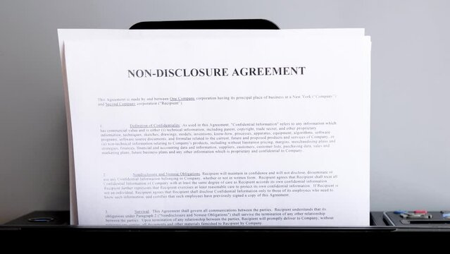 Printing the NDA document. Non-disclosure agreement. 4K footage