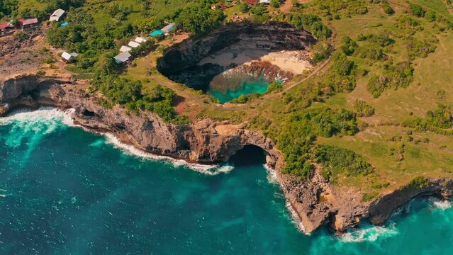 Beautiful Bali beach, Broken Beach (Pantai Pasih Uug) Devil's Billabong  with scenery stone bridge and nature pool on nature background Bali, Indonesia 4K