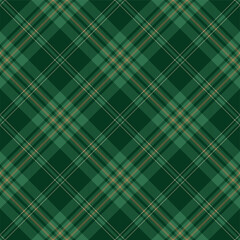 Green and brown argyle tartan plaid. Scottish pattern fabric swatch close-up. 