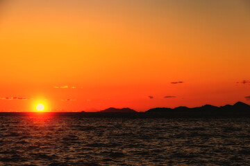 The sun sets over the horizon in the Adriatic Sea