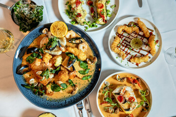 Set for two of seafood for dinner, Grilled shrimps or prawns served with lemon, garlic and sauce