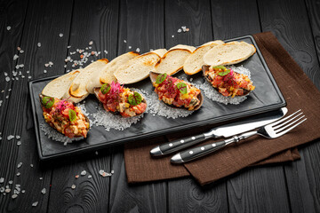 Tuna ceviches, mussels and caviar on mussel shells