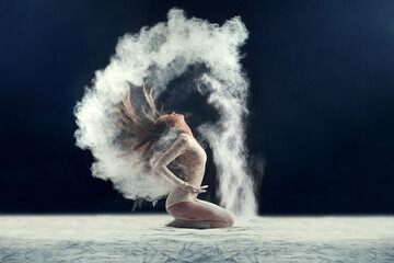Sensationally sensual. Studio shot of a young woman leaving a trail of powder in the air by whipping her hair. - obrazy, fototapety, plakaty