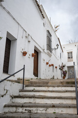 Fototapeta na wymiar Stairs on the street of a traditional white village in south Spain