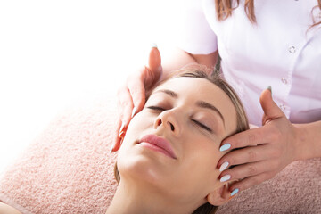 Fototapeta na wymiar Beauty expert performing relaxing massage
