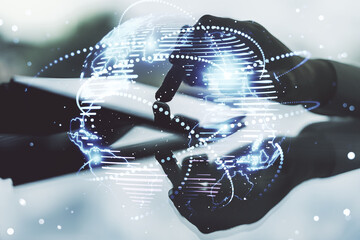 Abstract graphic digital world map with connections and finger presses on a digital tablet on...