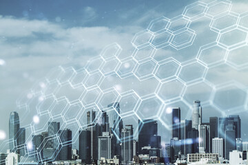 Abstract virtual wireless technology hologram with hexagon on Los Angeles skyline background. Big...