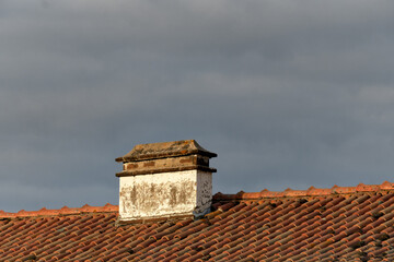 typical carved chimney on and whitewashed house in the old town of Evora, Alentejo, Portugal	