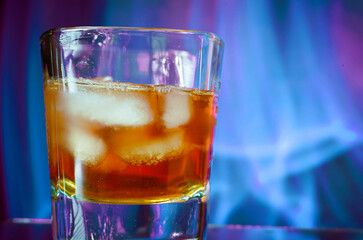 Glass of whiskey with ice