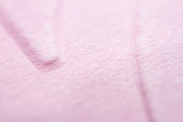 Extreme macro of embossed pink paper