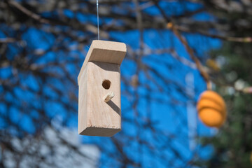 Small decor wooden bird houses boxes hanging on tree