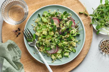 Foto op Plexiglas Fresh salad with avocado, bulgur, cucumber, radish and microgreens © anna_shepulova