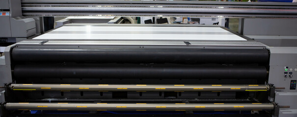 Flatbed and roll UV printer. Printing industry.