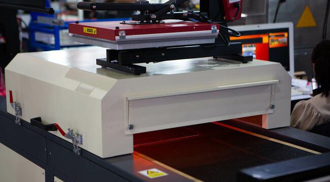 Infrared t-shirt screen print drying machine. Printing industry.
