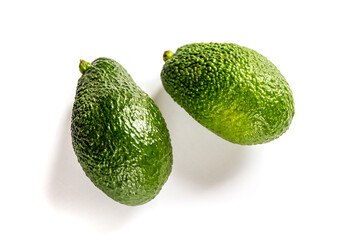 Two avocados isolated on a white background