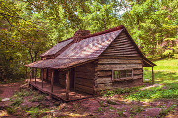 old log cabin in forest, Noah Bug Ogle Farm in Smoky Mountain National Park.