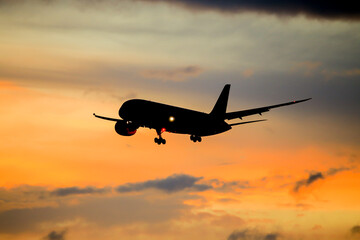 Fototapeta na wymiar airplane in the sunset