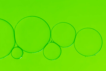 Oil buble on bright green background.