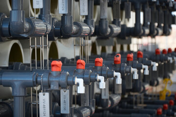 Row of hand operated valves on a water treatment system