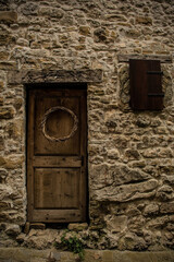 An old wooden door in Poffabro, an historic medieval village in the Val Colvera valley in Pordenone province, Friuli-Venezia Giulia, north east Italy
