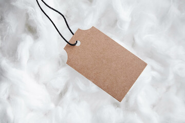 Label tag mockup on white cotton background