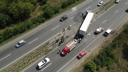 The truck and the car collided on the highway. Strong accident. Traffic accidents on the road. View from above. Traffic jam on the road.