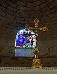 The decorative stained glass window in the lower hall of the St. Josephs Church in Nazareth,...