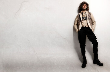 Fashion Model Poses against the wall in Greek Islan Mykonos