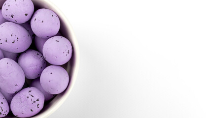 Purple eggs in a bowl on a white background 