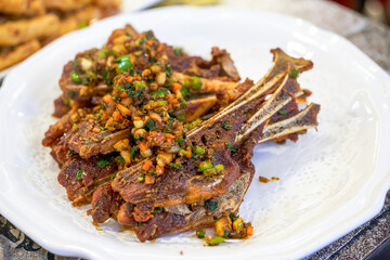 A delicious fried pork fan bone with salt and pepper