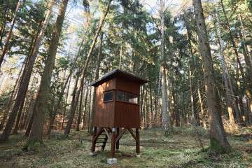 The hunting pulpit of the hunter in the middle of the forest. The observation point, high seat,...
