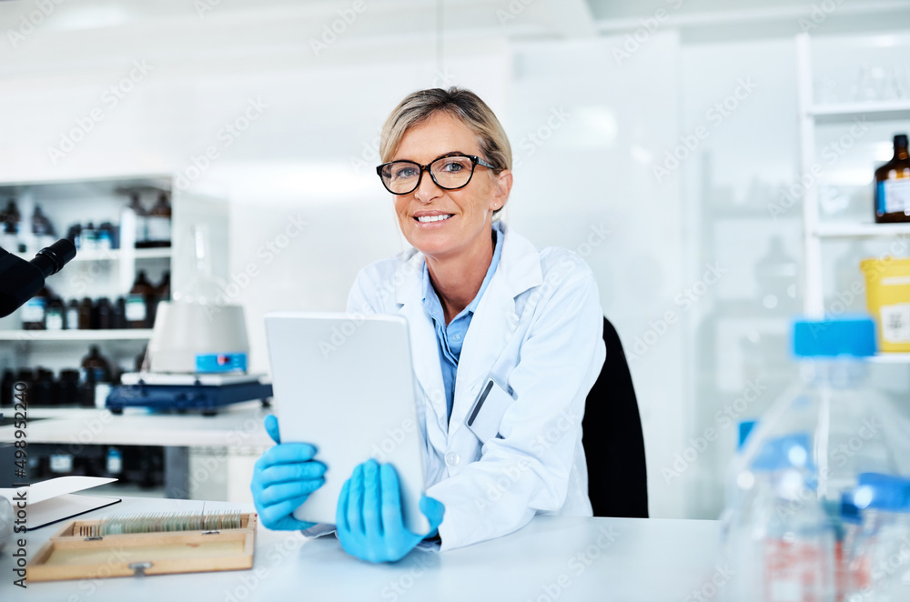 Poster This tool allows me to log my findings so easily. Portrait of a mature scientist using a digital tablet in a lab.