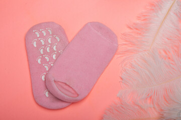 female booty gel socks and gloves isolated on a white background. body care, cosmetology.