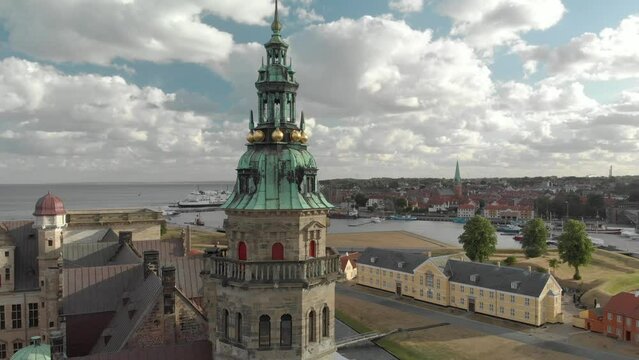 Cinematic 4K aerial drone reveal shot of Kronborg Slot Castle, one of UNESCO's World Heritage sites, Helsing&oslash;r city and Marina in in Denmark