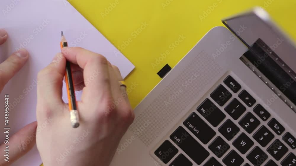 Aufkleber topdown view of man typing on computer keyboard then writes my plans on white paper, yellow backgrou