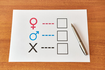 A person is determined by his gender. Sheet of paper with gender symbols. The right to one's...