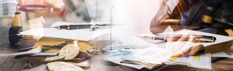 justice and law concept.Male judge in a courtroom on wooden table and Counselor or Male lawyer working in office. Legal law, advice and justice concept.