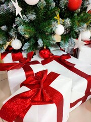 Gifts under the Christmas tree close-up. New Year's background.