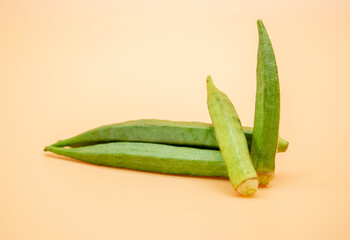 fresh okra isolated on colorful background
