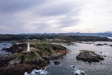 Fototapeta na wymiar 曇天の夕暮れの岬の風景