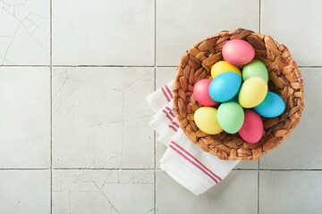 Easter eggs. Dyed Easter eggs with marble stone effect ref and blue color in rustic style over light grey old cracked tile table background. Easter background. Top view.