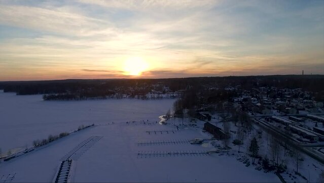 Aerial overview of frozen lake in Nokia town. Winter with snow in Finland