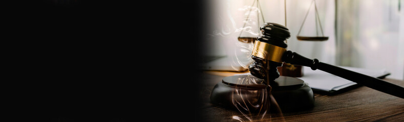 justice and law concept.Male judge in a courtroom on wooden table and Counselor or Male lawyer working in office. Legal law, advice and justice concept.