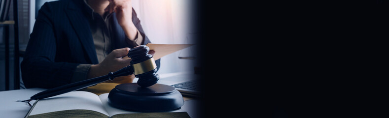 justice and law concept.Male judge in a courtroom on wooden table and Counselor or Male lawyer working in office. Legal law, advice and justice concept.