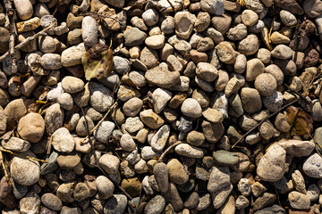Small rocks construction background. Crushed stones texture of buildings and roads for landscaping top view. High quality photo