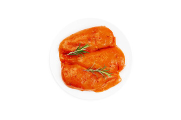 Marinated chicken fillet in red sauce on an isolated background.Top view.Copy space.Fast food, food at home.