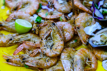Prepared shrimps and oysters on the plate