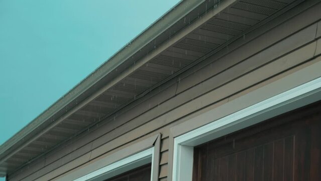 Water dripping from the gutter of a house after a huge thunderstorm