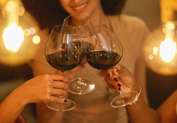 Cheers to being besties forever. Shot of a group of female friends clinking wine glasses.