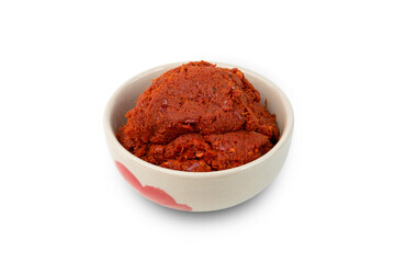 Thai red curry paste in a bowl isolated on white background with Clipping Path
